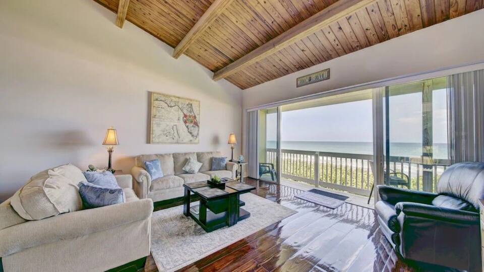 View of the living room of the The Flying Pelican - Peaceful Beachfront Oasis- Walk onto the sand!