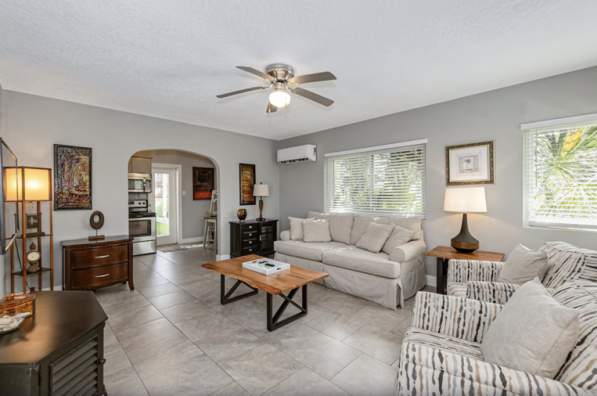 View of the living room of the Beautiful downtown Melbourne Beach renovated apartment one block from the beach!